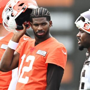 Cleveland Browns quarterback Shedeur Sanders (12) listens to a play call during mini camp at CrossCountry Mortgage Campus.
