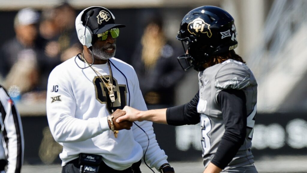 Apr 19, 2025; Boulder, CO, USA; Colorado Buffaloes head coach Deion Sanders and place kicker Buck Buchanan (43) during the spring game at Folsom Field.
