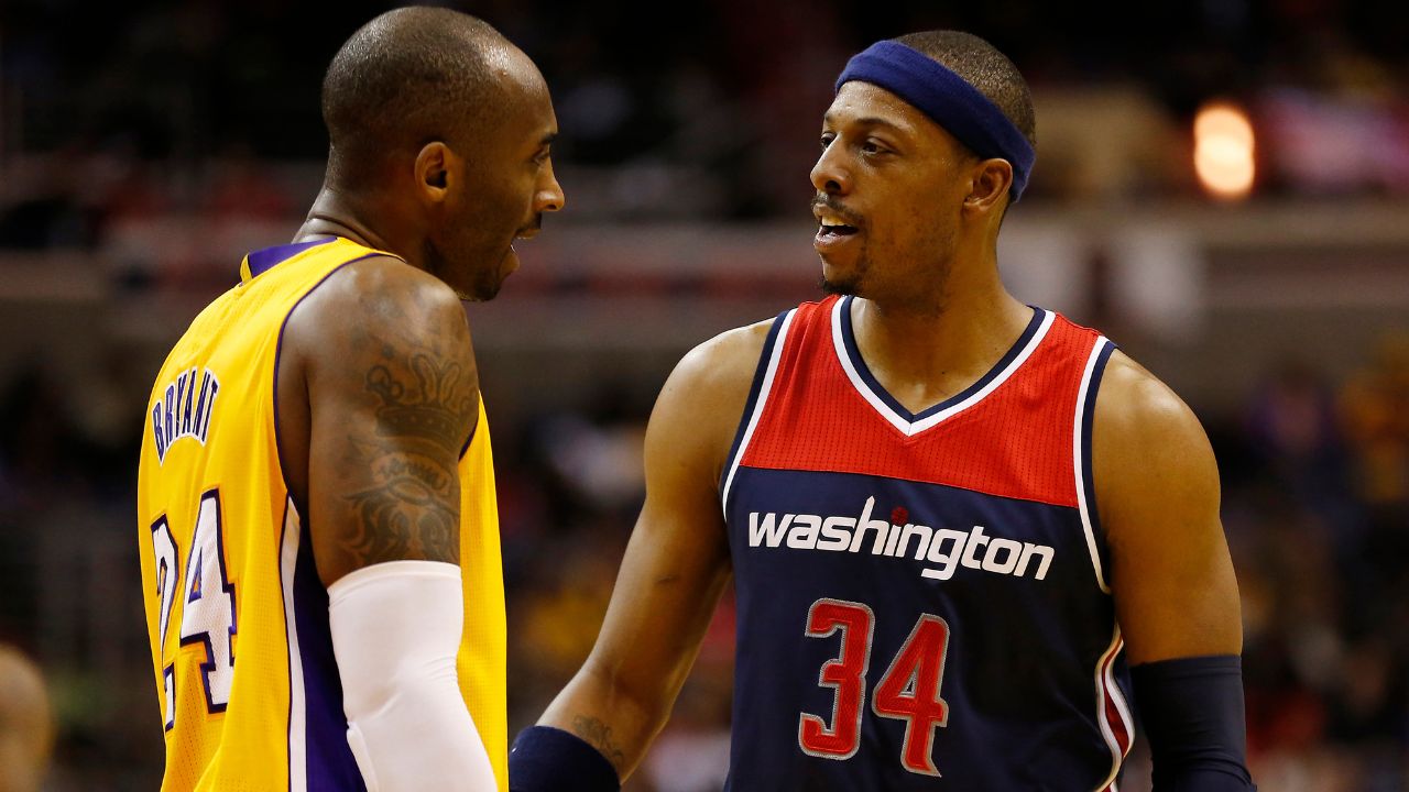 Washington Wizards forward Paul Pierce (34) talks to Los Angeles Lakers guard Kobe Bryant (24) in the third quarter at Verizon Center. The Wizards won 111-95.