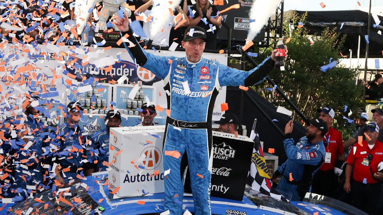 NASCAR Cup Series driver Denny Hamlin celebrates in victory lane after winning the Autotrader EchoPark Automotive 400 at Dover Motor Speedway.