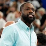 Dwyane Wade looks on at halftime between France and Canada in a men’s basketball quarterfinal game during the Paris 2024 Olympic Summer Games at Accor Arena.