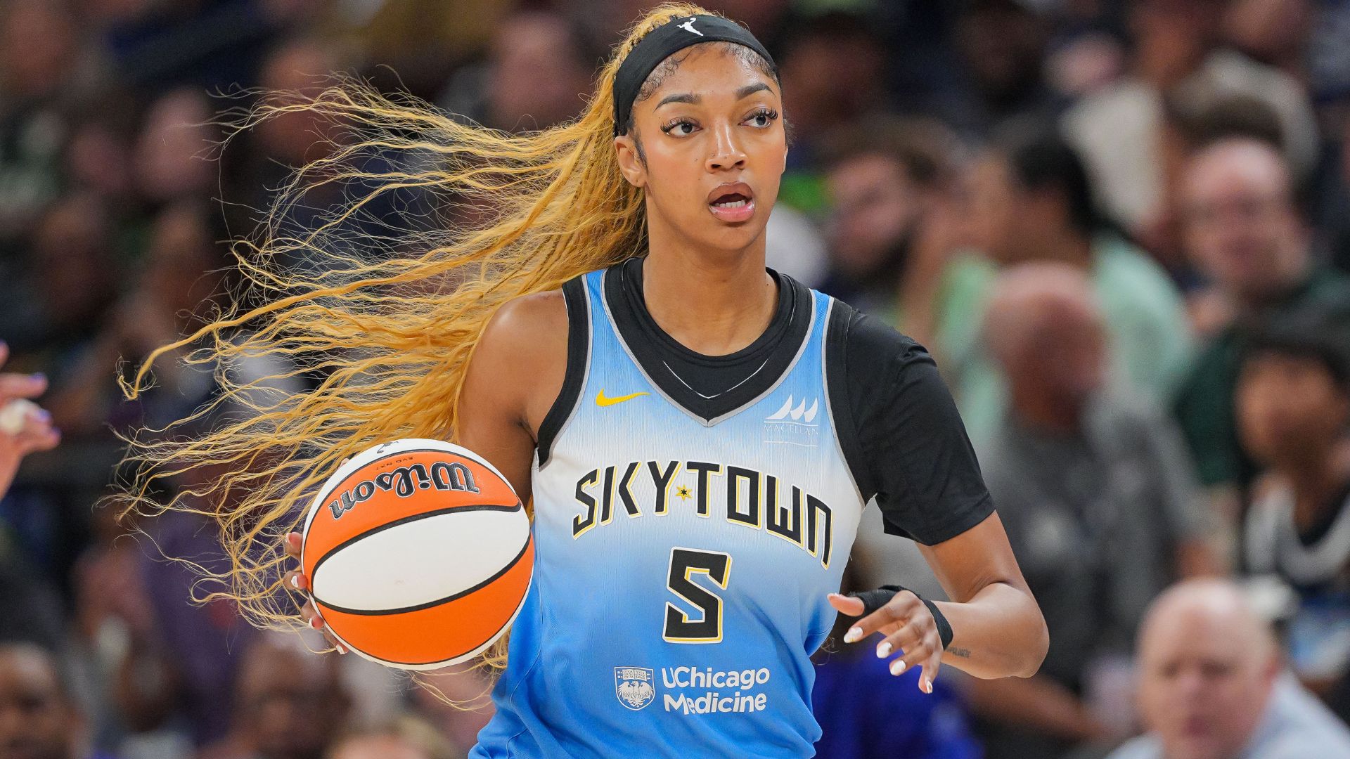 Jul 22, 2025; Minneapolis, Minnesota, USA; Chicago Sky forward Angel Reese (5) dribbles against the Minnesota Lynx in the first quarter at Target Center.