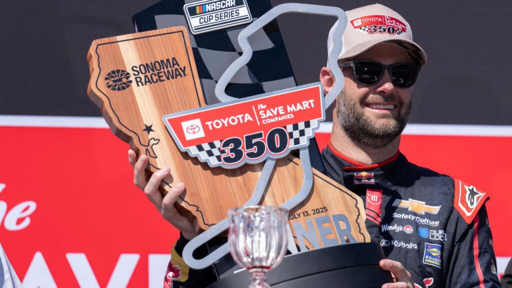 NASCAR Cup Series driver Shane van Gisbergen (88) poses for a photo with the trophy after winning the NASCAR Toyota / Save Mart 350 at Sonoma Raceway.