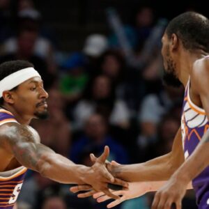 Phoenix Suns guard Bradley Beal (3) celebrates his basket against the Minnesota Timberwolves with forward Kevin Durant (35) in the fourth quarter at Target Center.