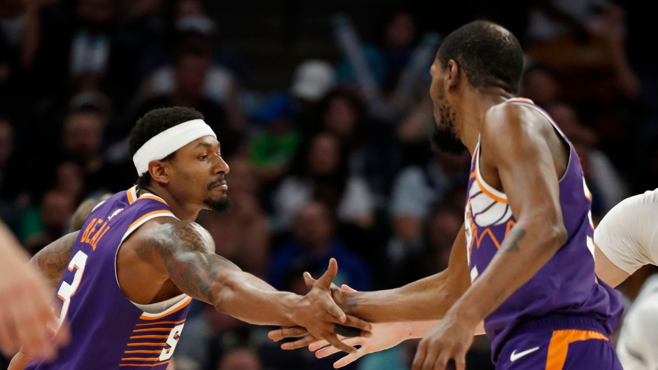 Phoenix Suns guard Bradley Beal (3) celebrates his basket against the Minnesota Timberwolves with forward Kevin Durant (35) in the fourth quarter at Target Center.