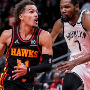 Dec 10, 2021; Atlanta, Georgia, USA; Atlanta Hawks guard Trae Young (11) tries to get to the basket guarded by Brooklyn Nets forward Kevin Durant (7) during the second half at State Farm Arena.