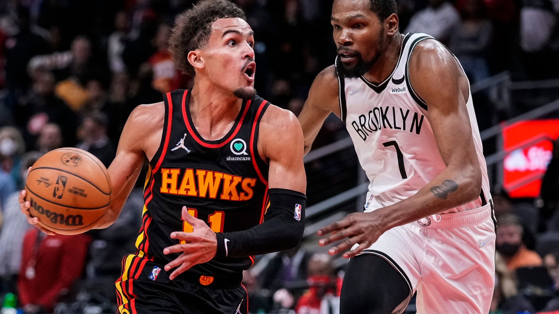 Dec 10, 2021; Atlanta, Georgia, USA; Atlanta Hawks guard Trae Young (11) tries to get to the basket guarded by Brooklyn Nets forward Kevin Durant (7) during the second half at State Farm Arena.