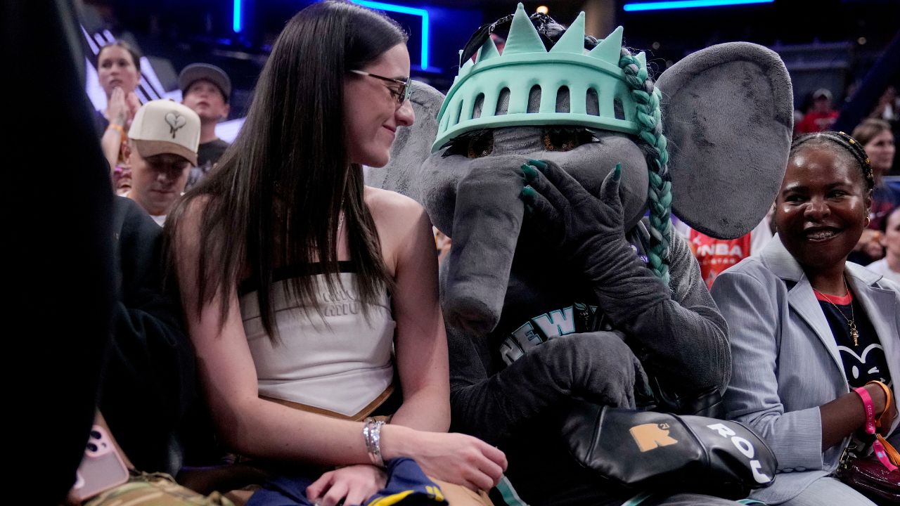 Caitlin Clark with Liberty mascot Ellie