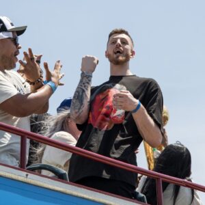 Oklahoma City Thunder player Isaiah Hartenstein yells at fans during the 2025 NBA Oklahoma City Thunder championship parade.