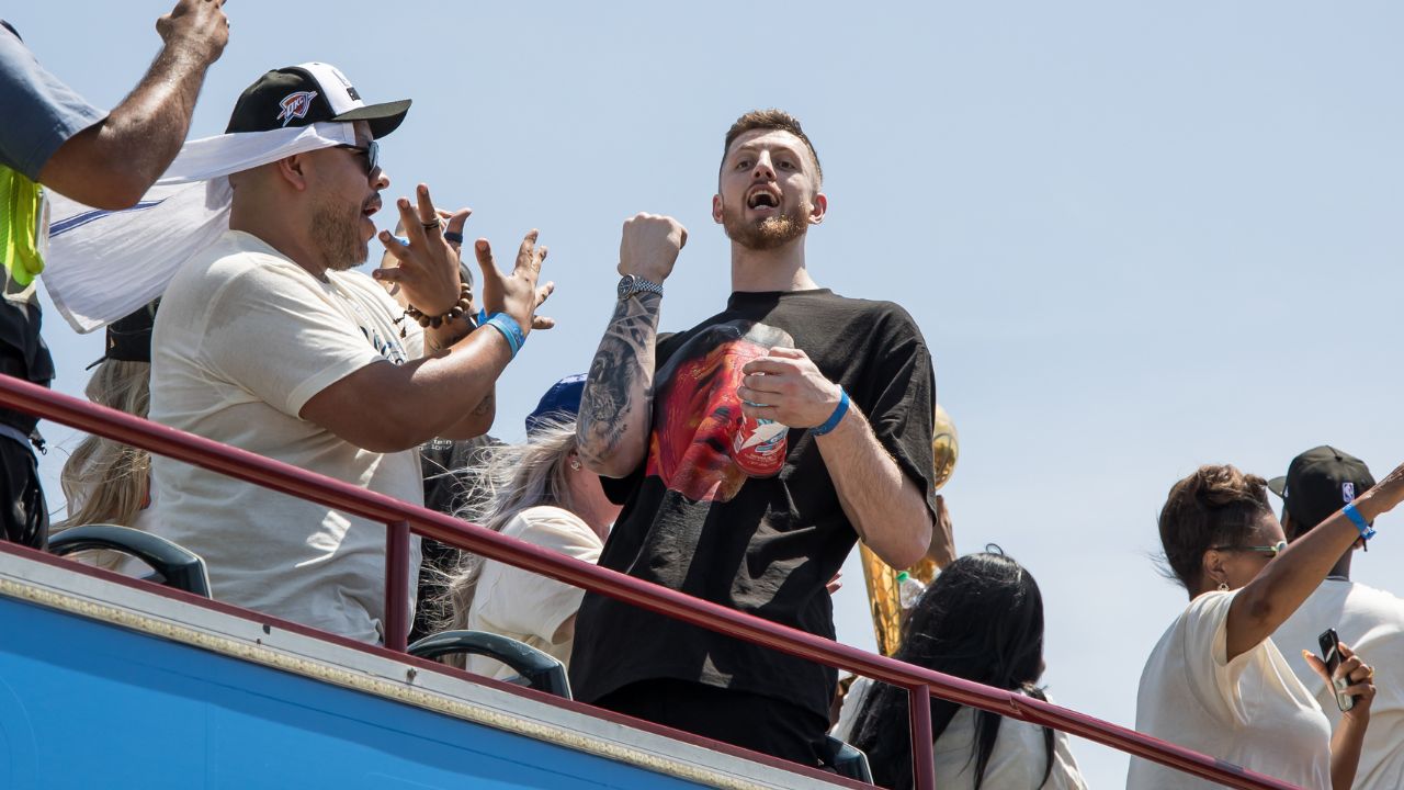 Oklahoma City Thunder player Isaiah Hartenstein yells at fans during the 2025 NBA Oklahoma City Thunder championship parade.