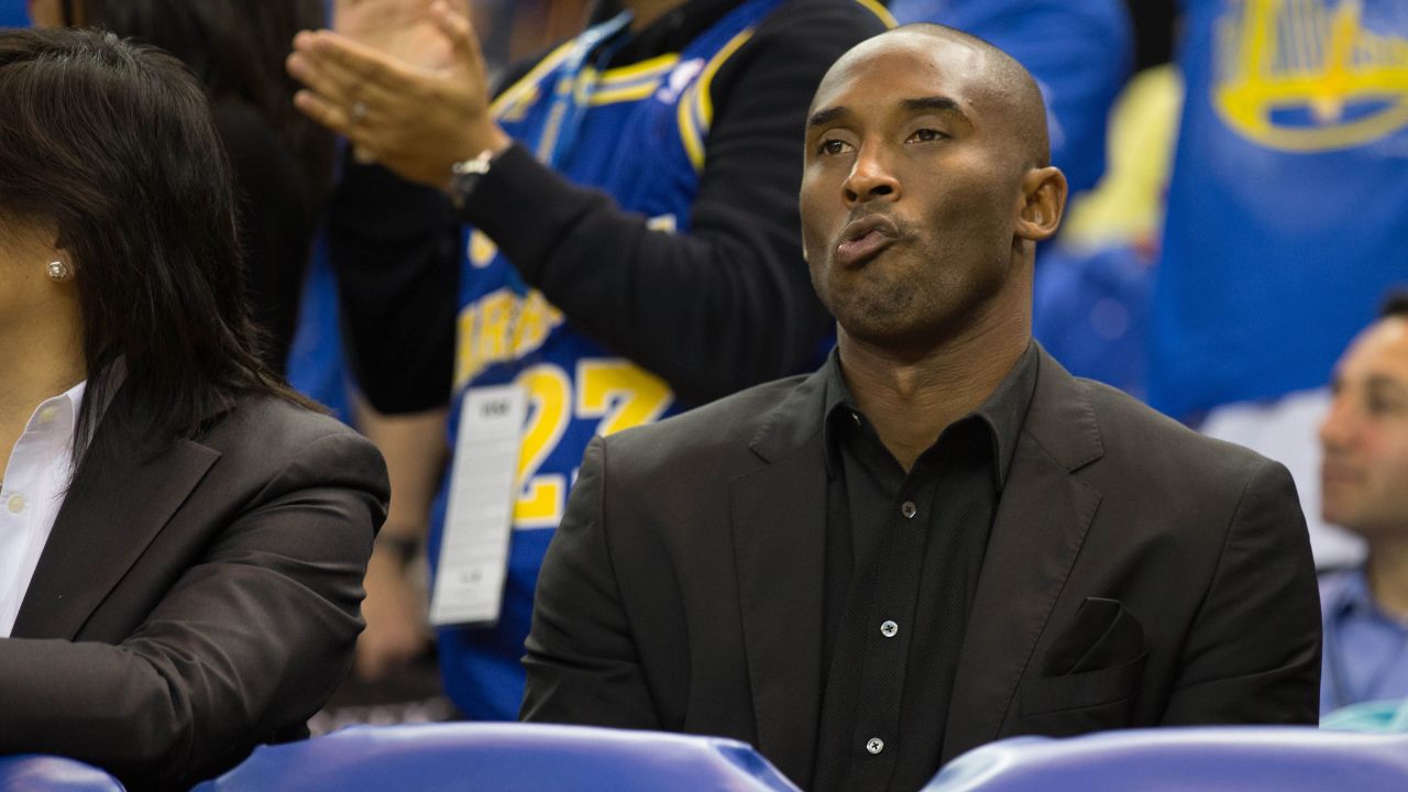Los Angeles Lakers shooting guard Kobe Bryant (24) behind the bench against the Golden State Warriors during the third quarter at Oracle Arena. The Golden State Warriors defeated the Los Angeles Lakers 125-94.