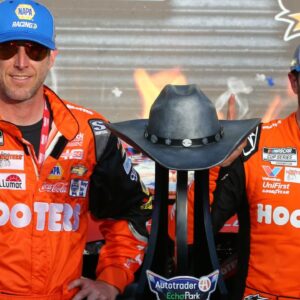 NASCAR Cup Series driver Chase Elliott (9) and crew chief Alan Gustafson celebrate in Victory Lane after winning the NASCAR Cup Series AutoTrader EchoPark 400 at Texas Motor Speedway.