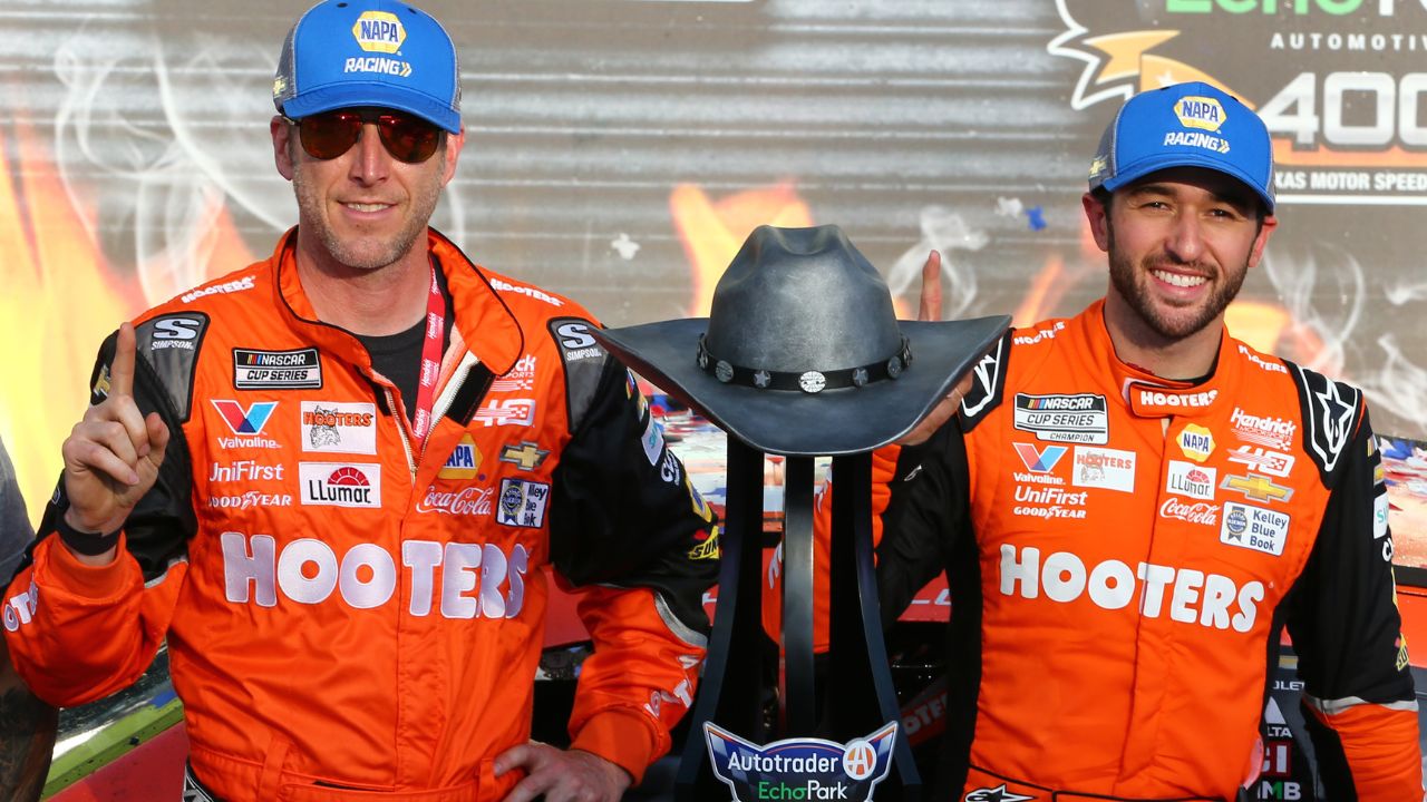 NASCAR Cup Series driver Chase Elliott (9) and crew chief Alan Gustafson celebrate in Victory Lane after winning the NASCAR Cup Series AutoTrader EchoPark 400 at Texas Motor Speedway.