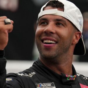 NASCAR Cup Series driver Bubba Wallace (23) reacts as he kisses the bricks Sunday, July 27, 2025, after winning the Brickyard 400 at Indianapolis Motor Speedway.