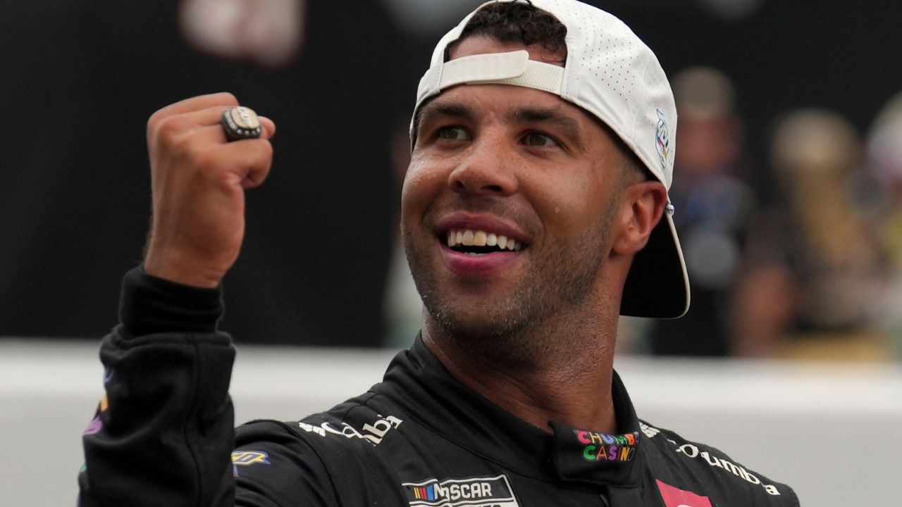 NASCAR Cup Series driver Bubba Wallace (23) reacts as he kisses the bricks Sunday, July 27, 2025, after winning the Brickyard 400 at Indianapolis Motor Speedway.