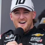 NASCAR Cup Series driver Ty Dillon (10) speaks with fans Saturday, July 26, 2025, ahead of qualifying for the Pennzoil 250 at Indianapolis Motor Speedway.