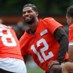 Browns quarterbacks Shedeur Sanders (12), Kenny Pickett (8) and Joe Flacco (15) talk during minicamp June 10, 2025, in Berea, Ohio.