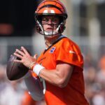 Cincinnati Bengals quarterback Joe Burrow (9) looks to throw during training camp practice.