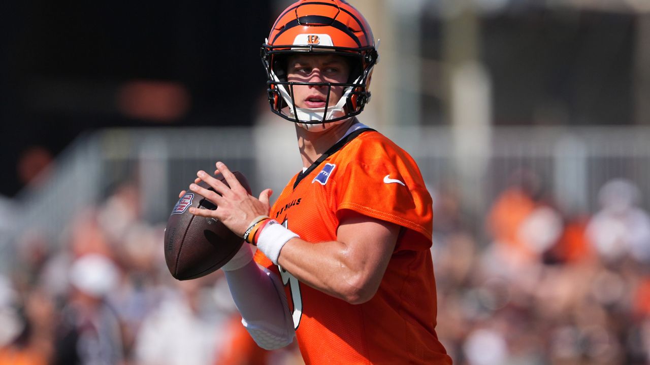 Cincinnati Bengals quarterback Joe Burrow (9) looks to throw during training camp practice.