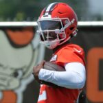 Browns quarterback Shedeur Sanders celebrates after breaking away for a big gain during practice, Wednesday, June 11, 2025, in Berea.