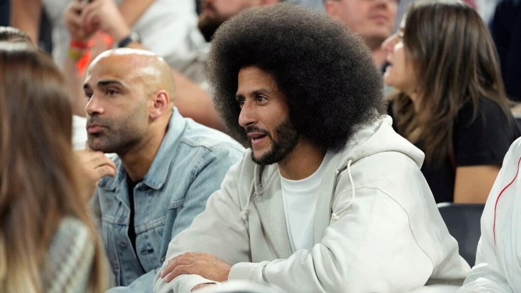 Former NFL player Colin Kaepernick looks on during the first half between the United States and Serbia in a men's basketball semifinal game during the Paris 2024 Olympic Summer Games at Accor Arena.