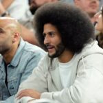 Former NFL player Colin Kaepernick looks on during the first half between the United States and Serbia in a men's basketball semifinal game during the Paris 2024 Olympic Summer Games at Accor Arena.