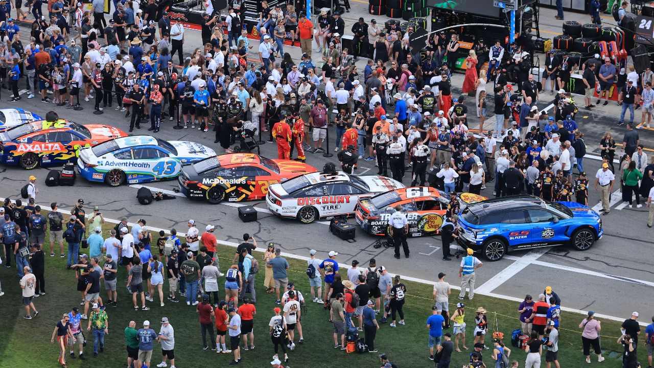 NASCAR fans participate in pre race activities on pit row before the Daytona 500 at Daytona International Speedway.