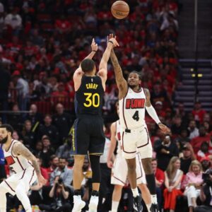 Golden State Warriors guard Stephen Curry (30) shoots the ball over Houston Rockets guard Jalen Green (4) during the fourth quarter of game seven of the first round for the 2025 NBA Playoffs at Toyota Center