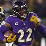 Jan 11, 2025; Baltimore, Maryland, USA; Baltimore Ravens running back Derrick Henry (22) runs to score a touchdown against the Pittsburgh Steelers in the third quarter in an AFC wild card game at M&T Bank Stadium.