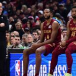 Cleveland Cavaliers forward Evan Mobley (4) and guard Donovan Mitchell (45) wait along side head coach Kenny Atkinson to enter the game during the first half against the New York Knicks at Rocket Arena.