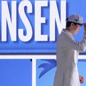 Jun 25, 2025; Brooklyn, NY, USA; Yang Hansen looks on after being selected as the 16th pick by the Memphis Grizzlies in the first round of the 2025 NBA Draft at Barclays Center.