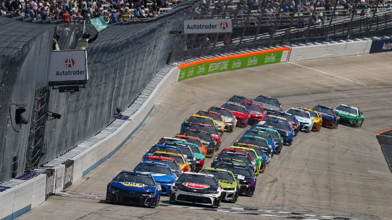 NASCAR Cup Series driver Chase Elliott (9) leads the field on a restart during the Autotrader EchoPark Automotive 400 at Dover Motor Speedway.