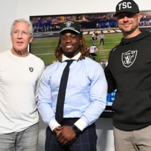 Las Vegas Raiders head coach Pete Carroll, Ashton Jeanty and general manager John Spytek pose after a news conference introducing Jeanty as the first round draft pick in the 2025 NFL Draft at Intermountain Health Performance Center.