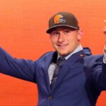 Johnny Manziel (Texas A&M) gestures on stage after being selected as the number twenty-two overall pick in the first round of the 2014 NFL Draft to the Cleveland Browns at Radio City Music Hall.