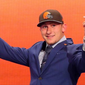 Johnny Manziel (Texas A&M) gestures on stage after being selected as the number twenty-two overall pick in the first round of the 2014 NFL Draft to the Cleveland Browns at Radio City Music Hall.