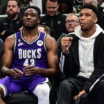 Apr 7, 2023; Milwaukee, Wisconsin, USA; Milwaukee Bucks forward Giannis Antetokounmpo (34) sits with his brother forward Thanasis Antetokounmpo (43) in the fourth quarter during game against the Memphis Grizzlies at Fiserv Forum.