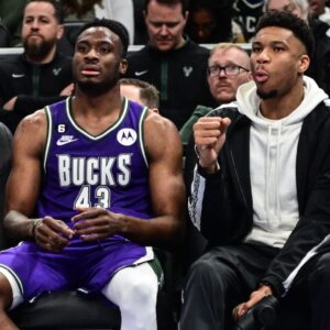 Apr 7, 2023; Milwaukee, Wisconsin, USA; Milwaukee Bucks forward Giannis Antetokounmpo (34) sits with his brother forward Thanasis Antetokounmpo (43) in the fourth quarter during game against the Memphis Grizzlies at Fiserv Forum.