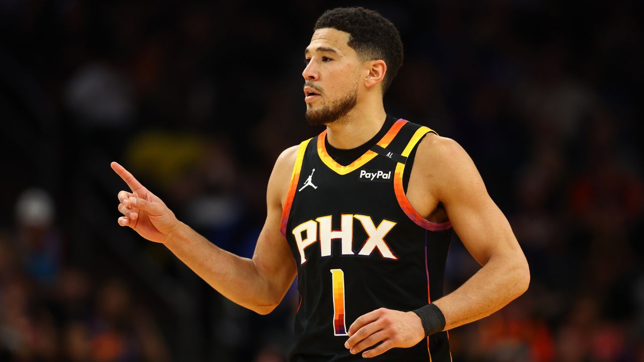Phoenix Suns guard Devin Booker (1) reacts after a play against the Oklahoma City Thunder during the first half at Footprint Center
