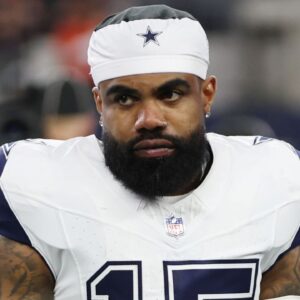 Dallas Cowboys running back Ezekiel Elliott (15) stands on the field before a game against the Cincinnati Bengals at AT&T Stadium.