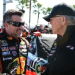 NASCAR Sprint Cup Series driver Tony Stewart (14) and team owner Joe Gibbs during qualifying for the Daytona 500 at Daytona International Speedway.