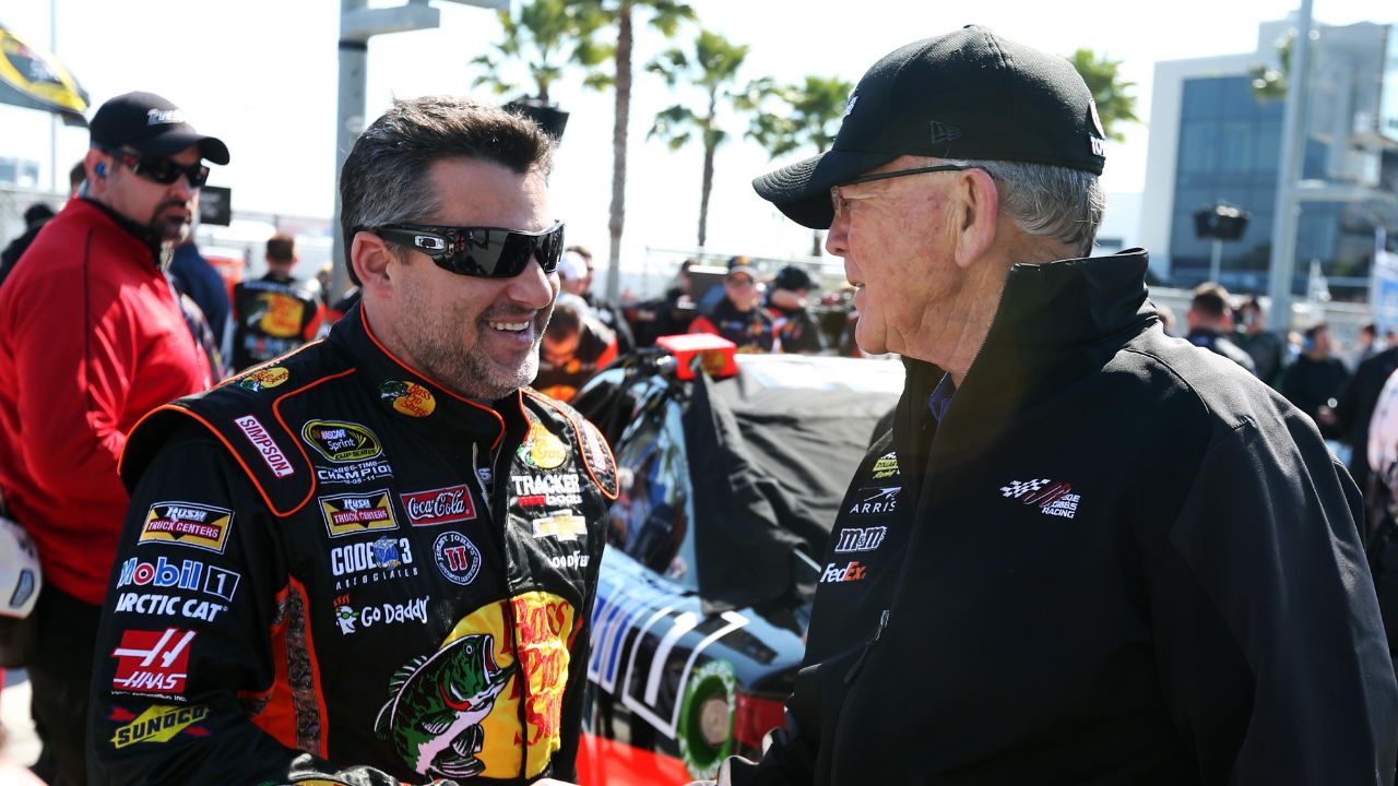 NASCAR Sprint Cup Series driver Tony Stewart (14) and team owner Joe Gibbs during qualifying for the Daytona 500 at Daytona International Speedway.