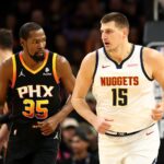 Dec 1, 2023; Phoenix, Arizona, USA; Denver Nuggets center Nikola Jokic (15) against Phoenix Suns forward Kevin Durant (35) at Footprint Center.