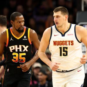 Dec 1, 2023; Phoenix, Arizona, USA; Denver Nuggets center Nikola Jokic (15) against Phoenix Suns forward Kevin Durant (35) at Footprint Center.