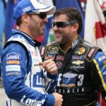 NASCAR Sprint Cup Series drivers Jimmie Johnson (L) and driver Tony Stewart (14) (R) share a laugh prior to the GoBowling.com 400 at Pocono Raceway.