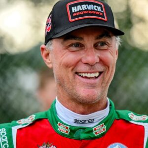 Former NASCAR Cup Series champion Kevin Harvick smiles during an autograph session before the 13th annual Masters of the Pros 200 race on Wednesday, July 16, 2025, at the Owosso Speedway. Harvick and his 13-year-old son Keelan competed against each other in the race later in the night.