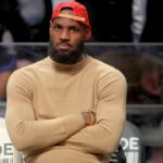 LeBron James watches from the bench