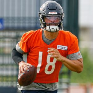 Chicago Bears quarterback Caleb Williams (18) runs with the ball during training camp at Halas Hall.
