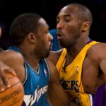 Los Angeles Lakers Kobe Bryant, right, defends the Washington Wizards Gilbert Arenas during the first half at the Staples Center in Los Angeles, California