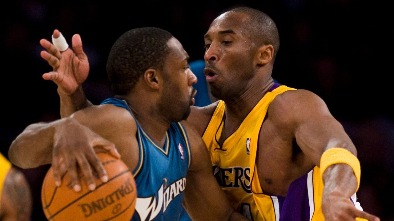 Los Angeles Lakers Kobe Bryant, right, defends the Washington Wizards Gilbert Arenas during the first half at the Staples Center in Los Angeles, California
