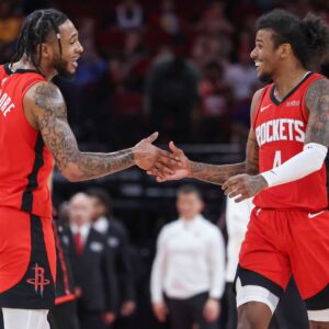 Feb 9, 2025; Houston, Texas, USA; Houston Rockets forward Cam Whitmore (7) and guard Jalen Green (4) celebrate after a play during the fourth quarter against the Toronto Raptors at Toyota Center